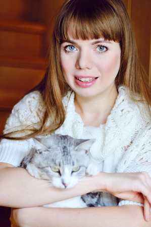 girl with het pet catの写真素材