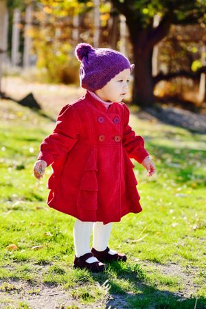 stylish baby girl in fall parkの写真素材