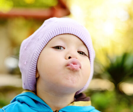 toddler girl  making funny  faceの写真素材