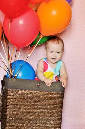funny birthday girl with balloonsの写真素材