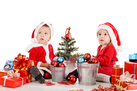 two funny baby girl santasの写真素材