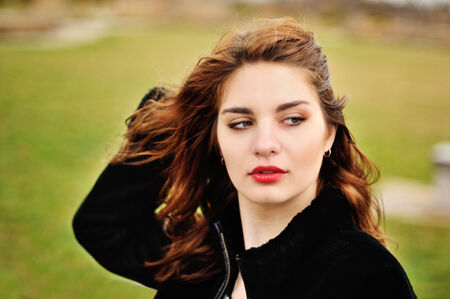 Portrait of young beautiful girl in windy weatherの写真素材