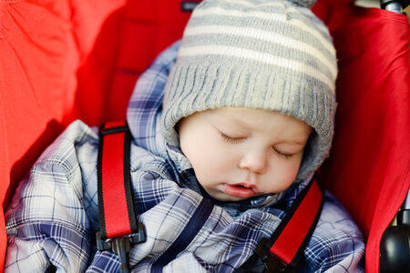 baby boy sleeping in the strollerの写真素材