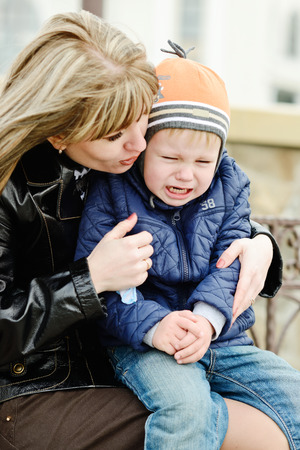 mother calming  down toddler sonの写真素材