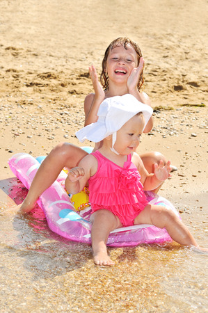 sisters on the sea near the waterの写真素材
