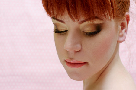 portrait of redhead young woman with make upの写真素材