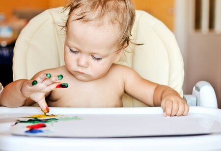 baby drawing with her fingersの写真素材