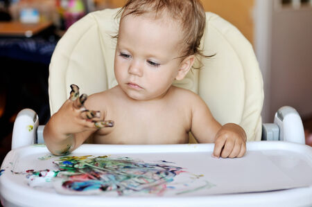baby drawing with her fingersの写真素材