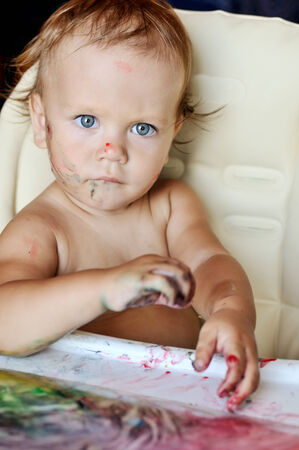 baby drawing with her fingersの写真素材