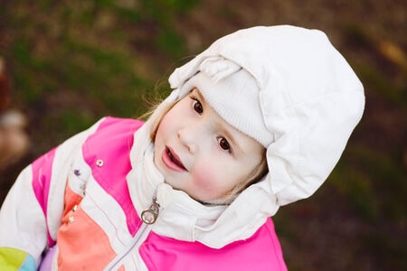 winter child with red cheeckの写真素材