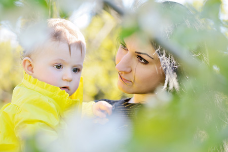mother and daughter in the blossom gardenの写真素材