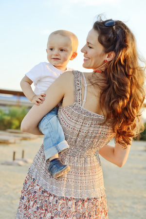 happy mother holding baby sonの写真素材