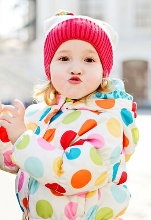 funny toddler girl making faceの写真素材