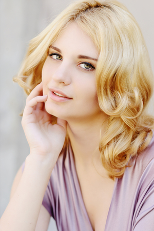 tender portrait of young blonde girlの写真素材