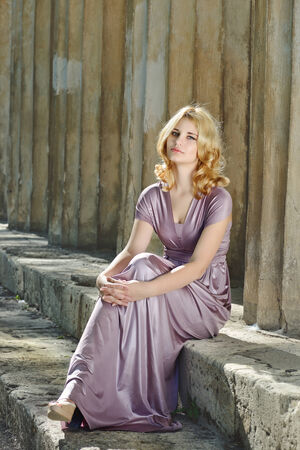 pretty blonde lady near the columnsの写真素材