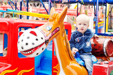 Little boy in the amusement parkの写真素材