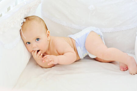 resting baby in the bed の写真素材