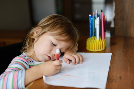 toddler girl drawing at home