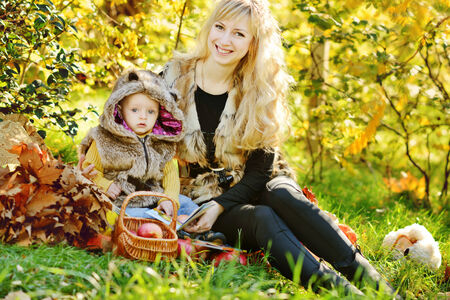 family in sunny november on the bright meadowの写真素材