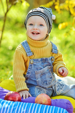 happy baby boy in sunny fall dayの写真素材