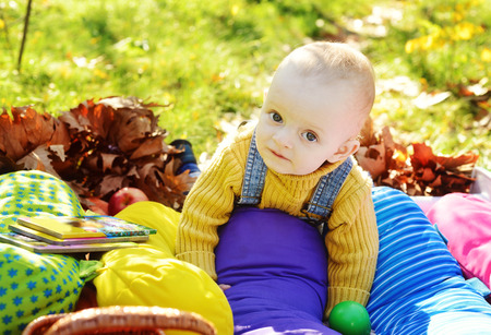 happy baby boy on sunny meadowの写真素材