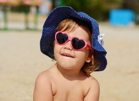 happy toddler girl  on the beachの写真素材