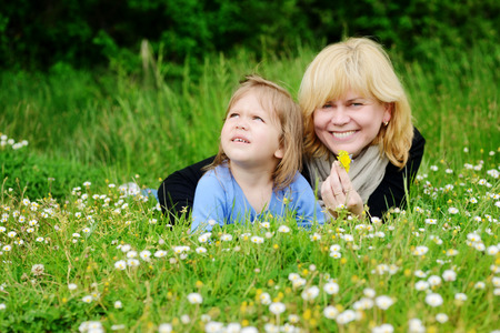 mother and  toddler girl on the meadowの写真素材