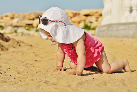 baby girl on the beachの写真素材