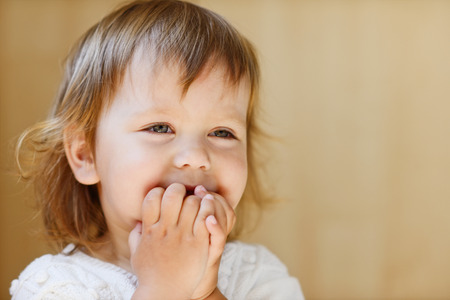 portrait of laughing toddler girlの写真素材
