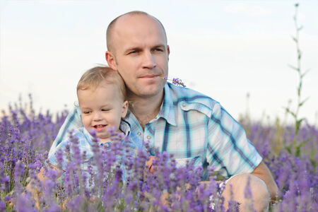 baby son with dad in lavender fieldの写真素材