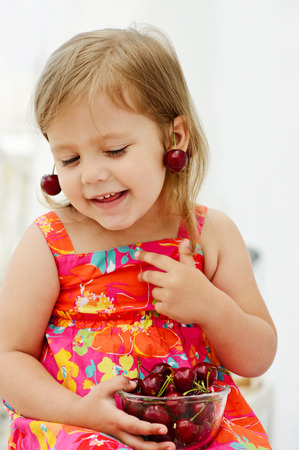 sweet little girl eating merryの写真素材