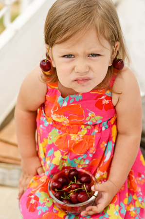 sweet little girl eating merryの写真素材