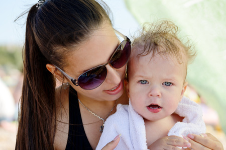 mother with son on the beachの写真素材