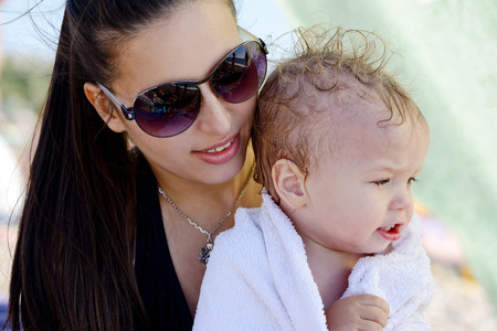 mother with son on the beachの写真素材