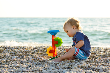 boy on the beach playing  toyの写真素材