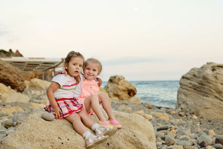 two little friends on the sea shoreの写真素材