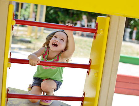 happy toddler girl on the playgroundの写真素材