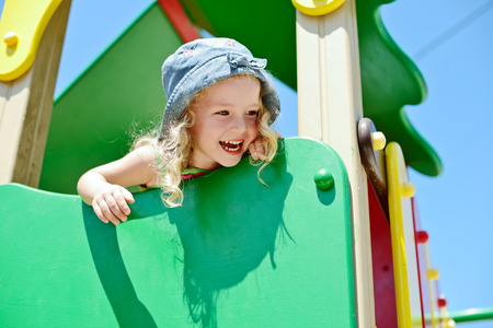 happy child having fun on the playgroundの写真素材