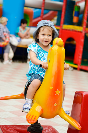 happy girl in the amusement parkの写真素材