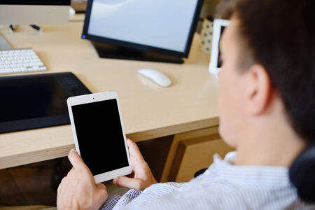 man in office with tablet pcの写真素材