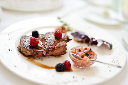 steak on a white plate in soft selective focusの写真素材