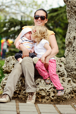mother with little daughter and baby sonの写真素材