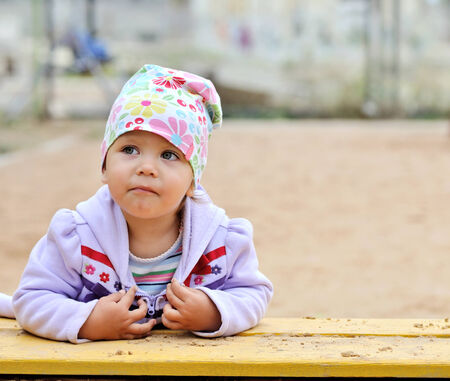 toddler girl on the playgroundの写真素材