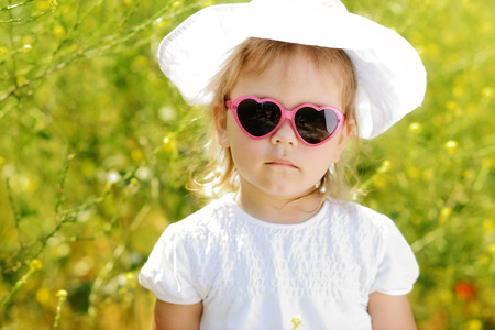 cute toddler in the rape fieldの写真素材