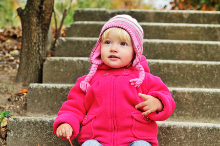 baby in fall time outdoorsの写真素材