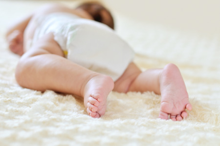 sweet dreams of newborn on the tummyの写真素材