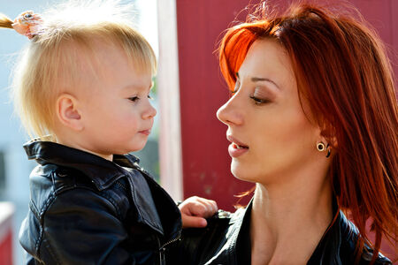 mother and her funny baby  daughterの写真素材