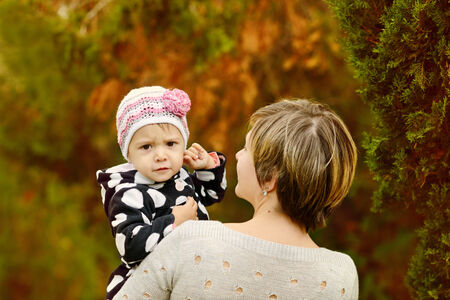 mother and her little girl in fall