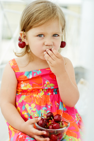 sweet little girl eating merryの写真素材