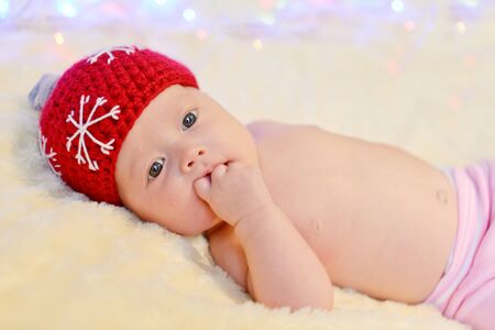 newborn baby wearing like a boll for christmas tree